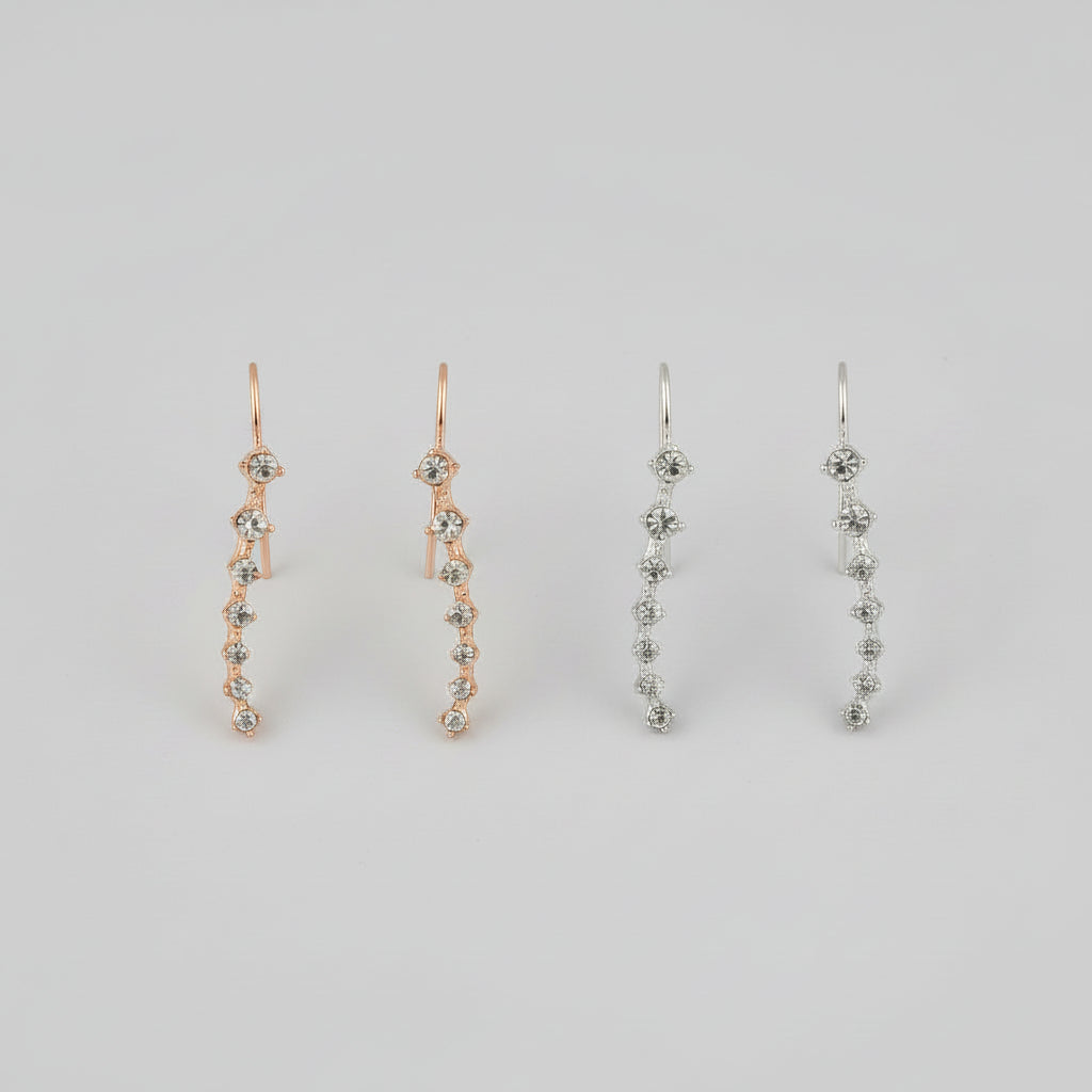Pair of diamond earrings shown from multiple angles including an ear close-up.