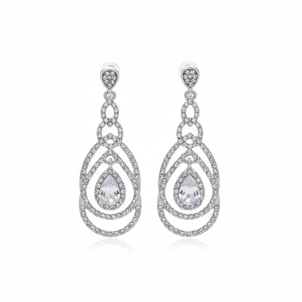 Silver teardrop earrings with clear stones on a white background