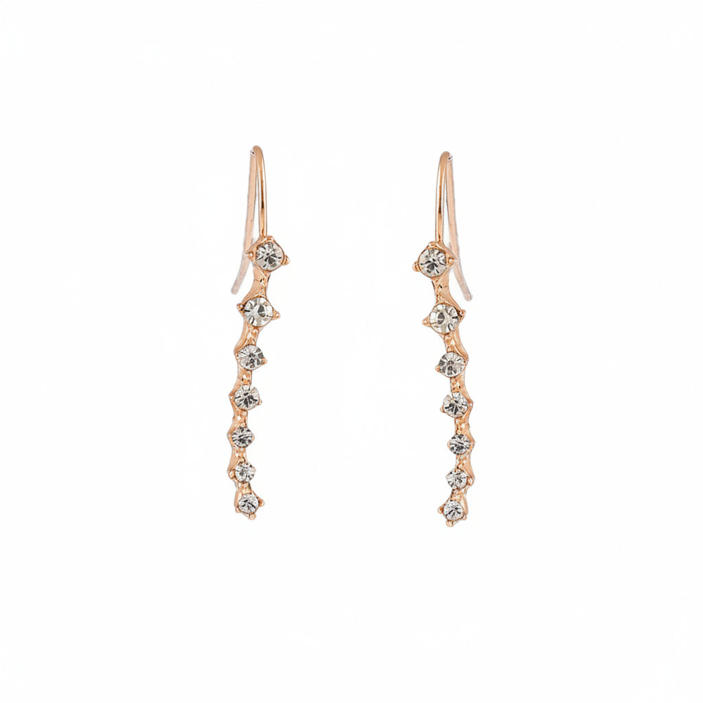 Pair of rose gold earrings with diamond-like stones on a white background