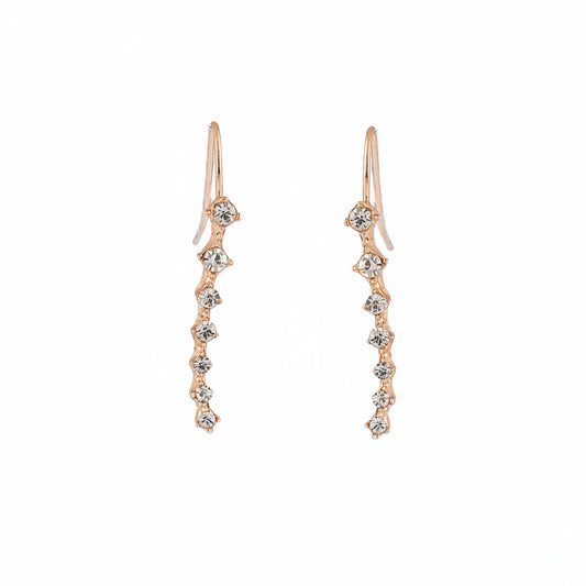 Pair of rose gold earrings with diamond-like stones on a white background