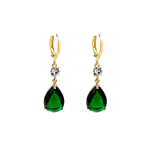 Gold earrings with green teardrop-shaped gemstones on a white background